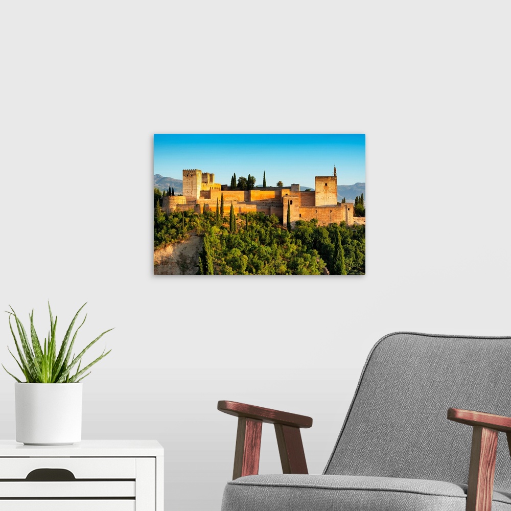 A modern room featuring It's a view of the Alhambra of Granada in Andalusia at sunset (Spain).