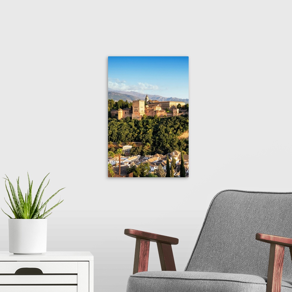 A modern room featuring It's a magnificent view of the Alhambra at sunset in Granada, Spain.