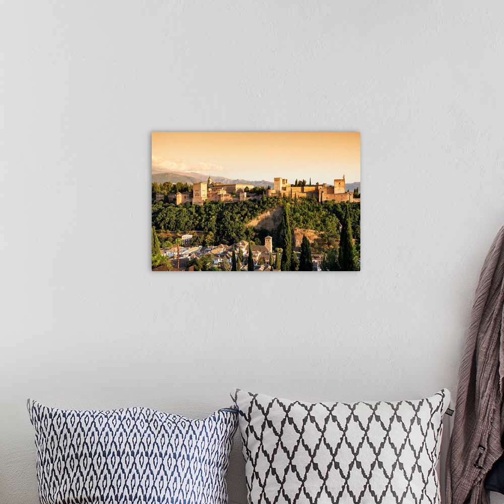 A bohemian room featuring It's a magnificent view of the Alhambra at sunset in Granada, Spain.
