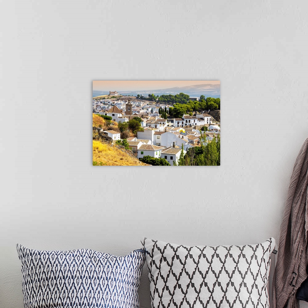 A bohemian room featuring It's a view of the white city of Antequera in Spain.