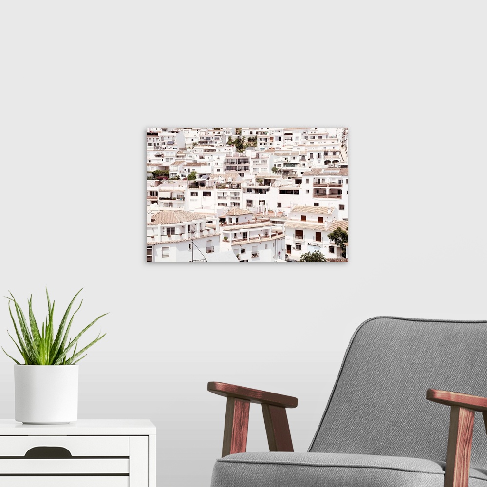 A modern room featuring It's a view of the white buildings in the city of Mijas (Malaga) in Andalusia, Spain.