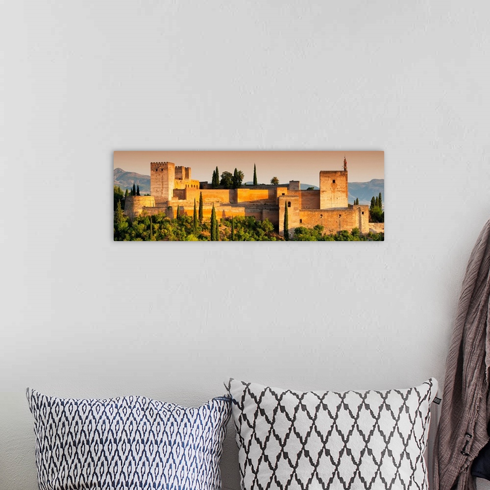 A bohemian room featuring It's a view of the Alhambra of Granada in Andalusia at sunset (Spain).