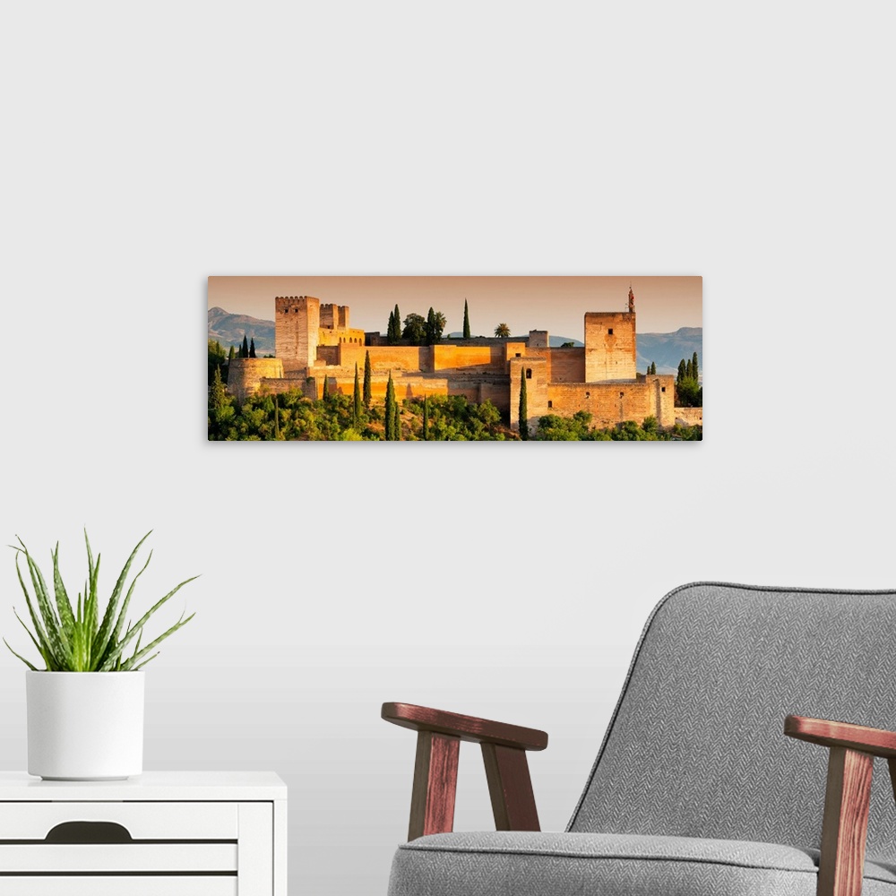 A modern room featuring It's a view of the Alhambra of Granada in Andalusia at sunset (Spain).
