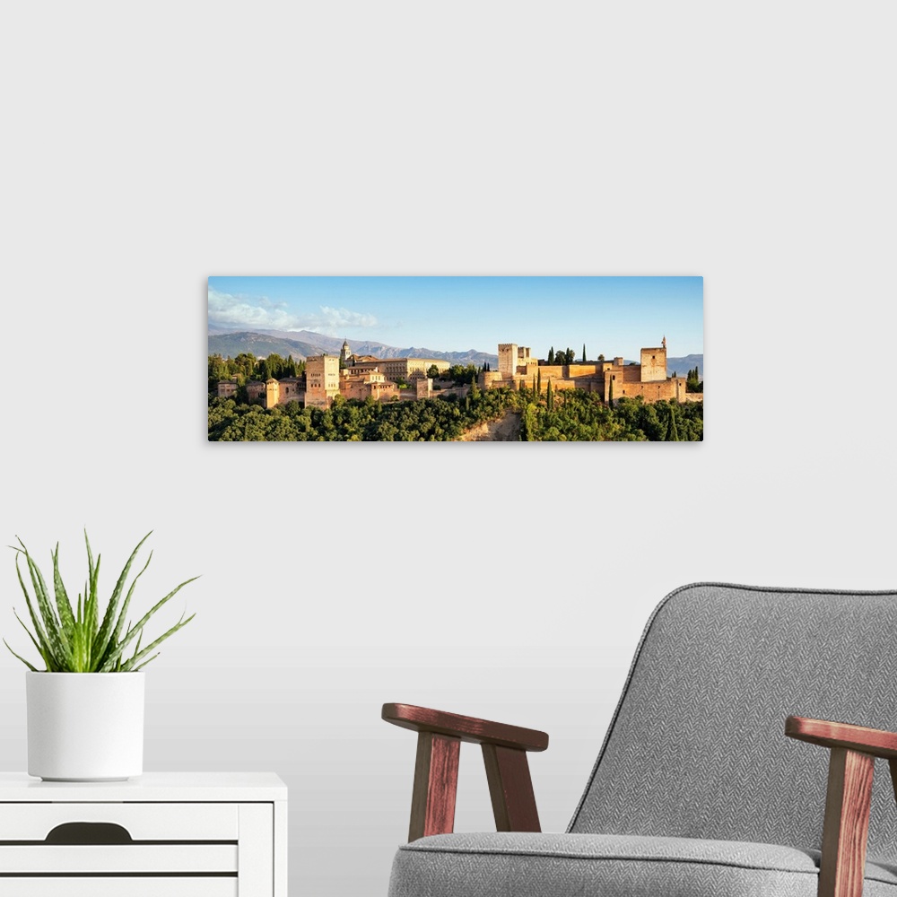 A modern room featuring It's a beautiful view of the Alhambra at sunset in Granada, Spain.