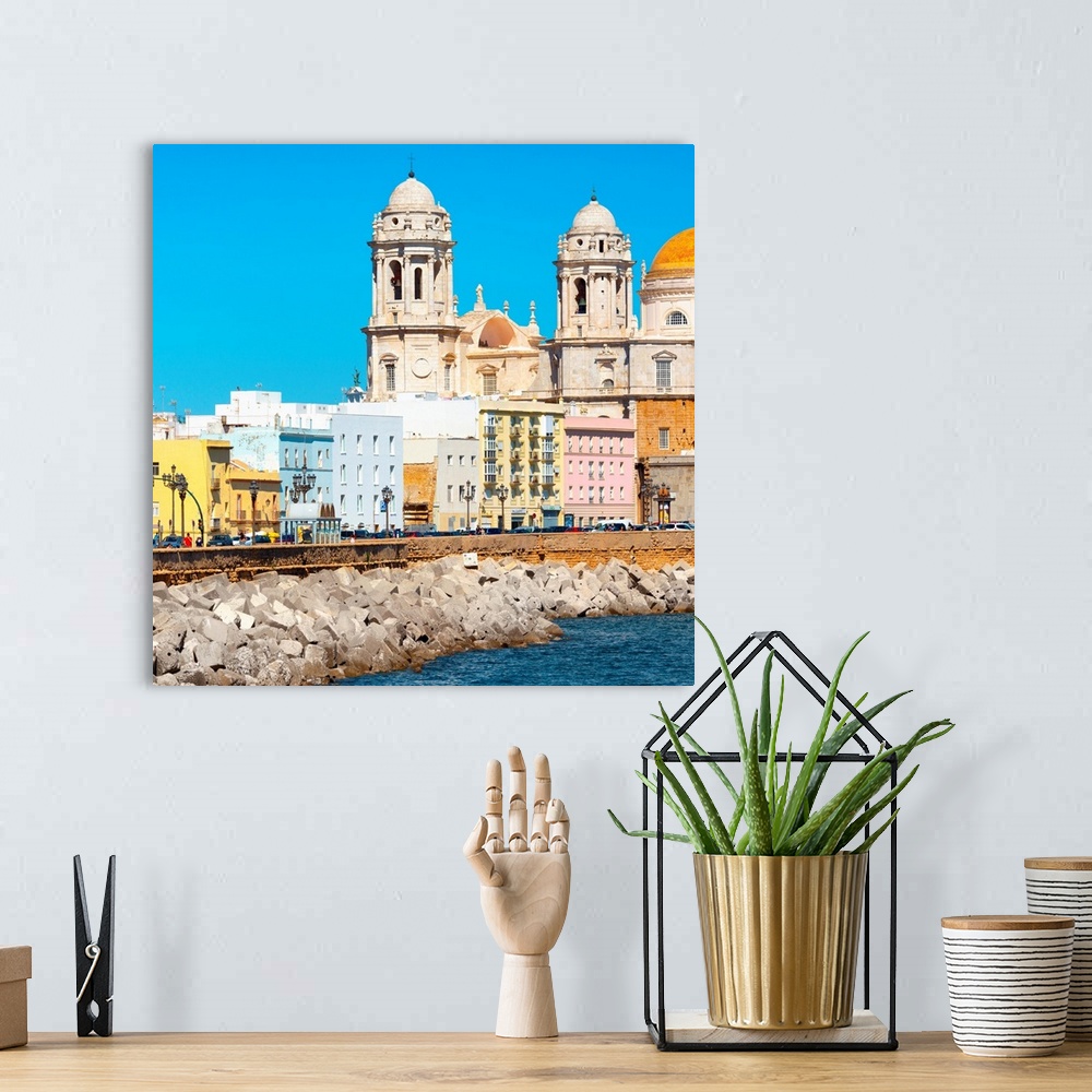 A bohemian room featuring It's the seaside on the city of Cadiz in Spain, with its colorful architecture.