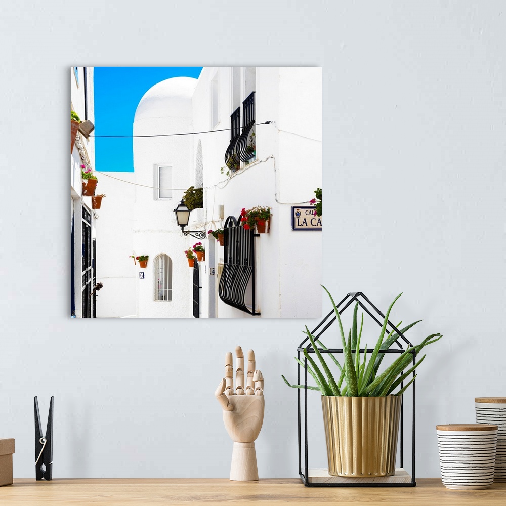 A bohemian room featuring It's a street with white facades in Mojacar, Spain.