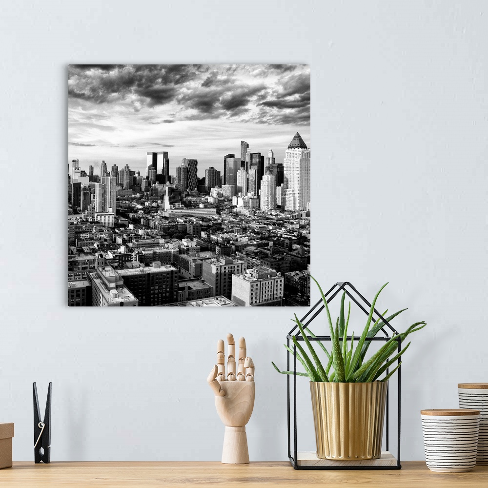 A bohemian room featuring A black and white photo of the New York City skyline under dramatic clouds.