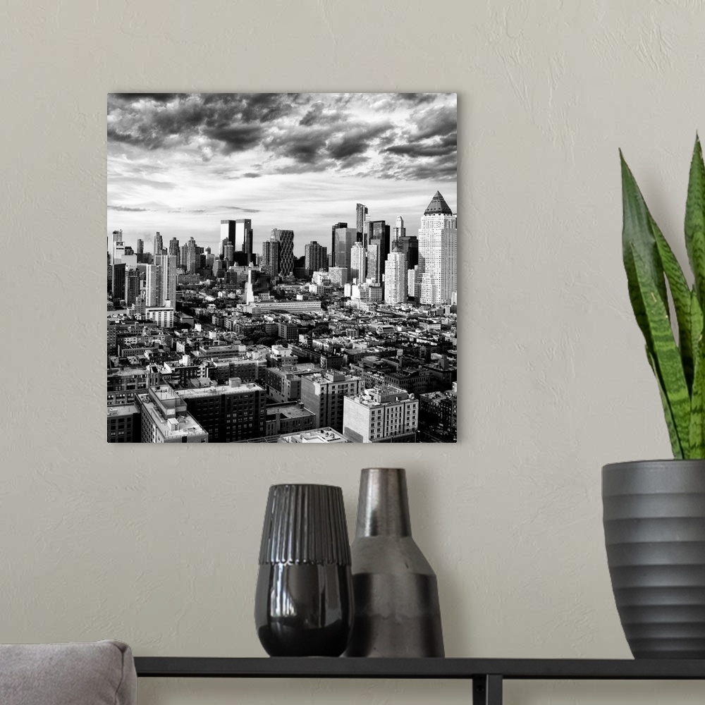 A modern room featuring A black and white photo of the New York City skyline under dramatic clouds.