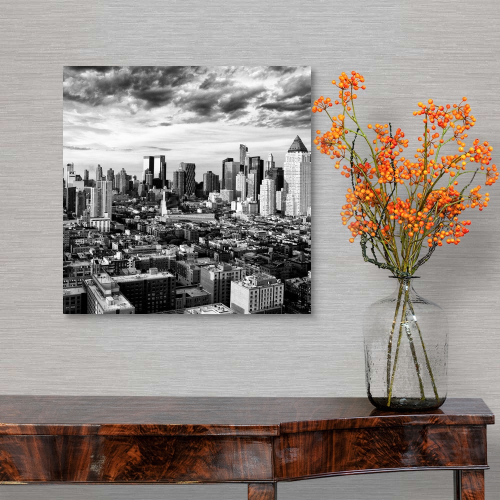 A traditional room featuring A black and white photo of the New York City skyline under dramatic clouds.