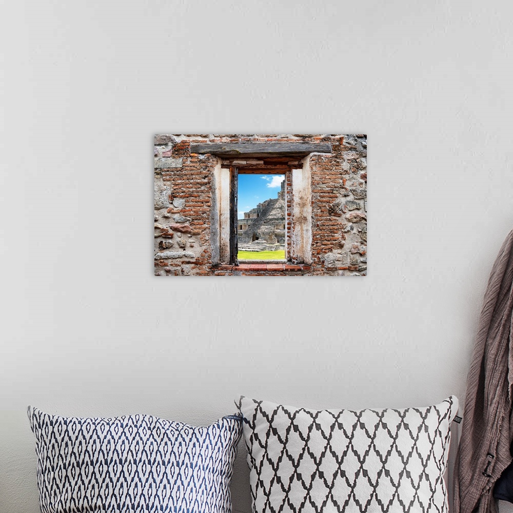 A bohemian room featuring View of the Mayan Ruins in Edzna, Mexico, framed through a stony, brick window. From the Viva Mex...