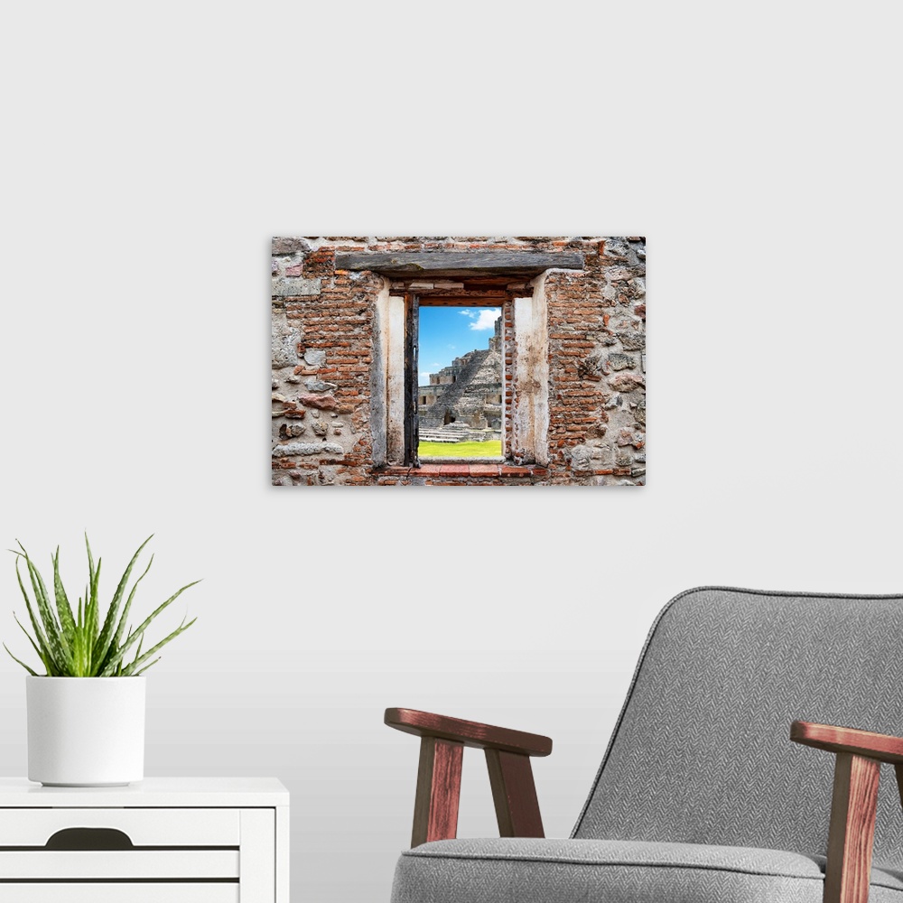 A modern room featuring View of the Mayan Ruins in Edzna, Mexico, framed through a stony, brick window. From the Viva Mex...