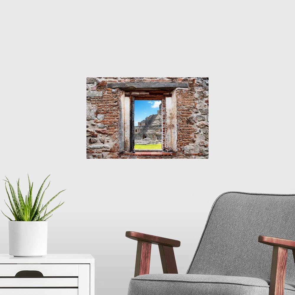 A modern room featuring View of the Mayan Ruins in Edzna, Mexico, framed through a stony, brick window. From the Viva Mex...