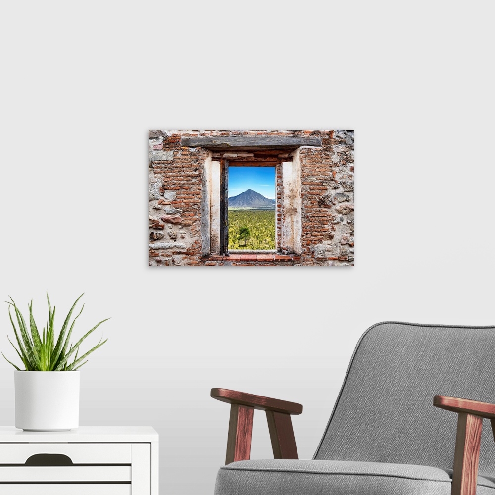 A modern room featuring View of the Mexican desert with a mountain in the background framed through a stony, brick window...