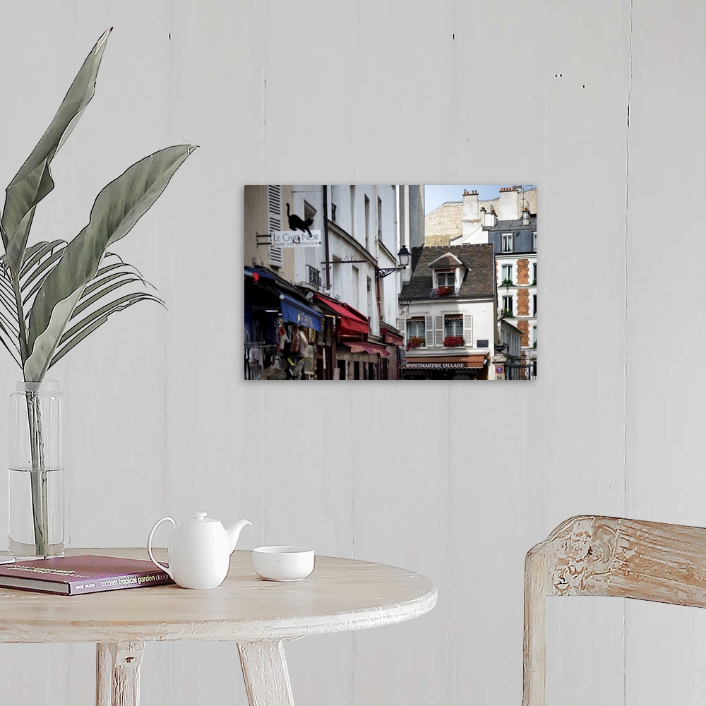 A farmhouse room featuring A photograph of a Parisian architecture in Montmarte.