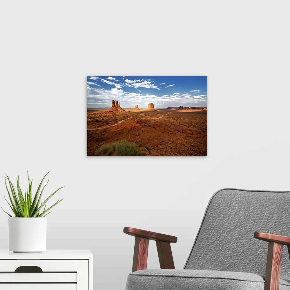 A modern room featuring Large rock formations in the desert landscape of Monument Valley.