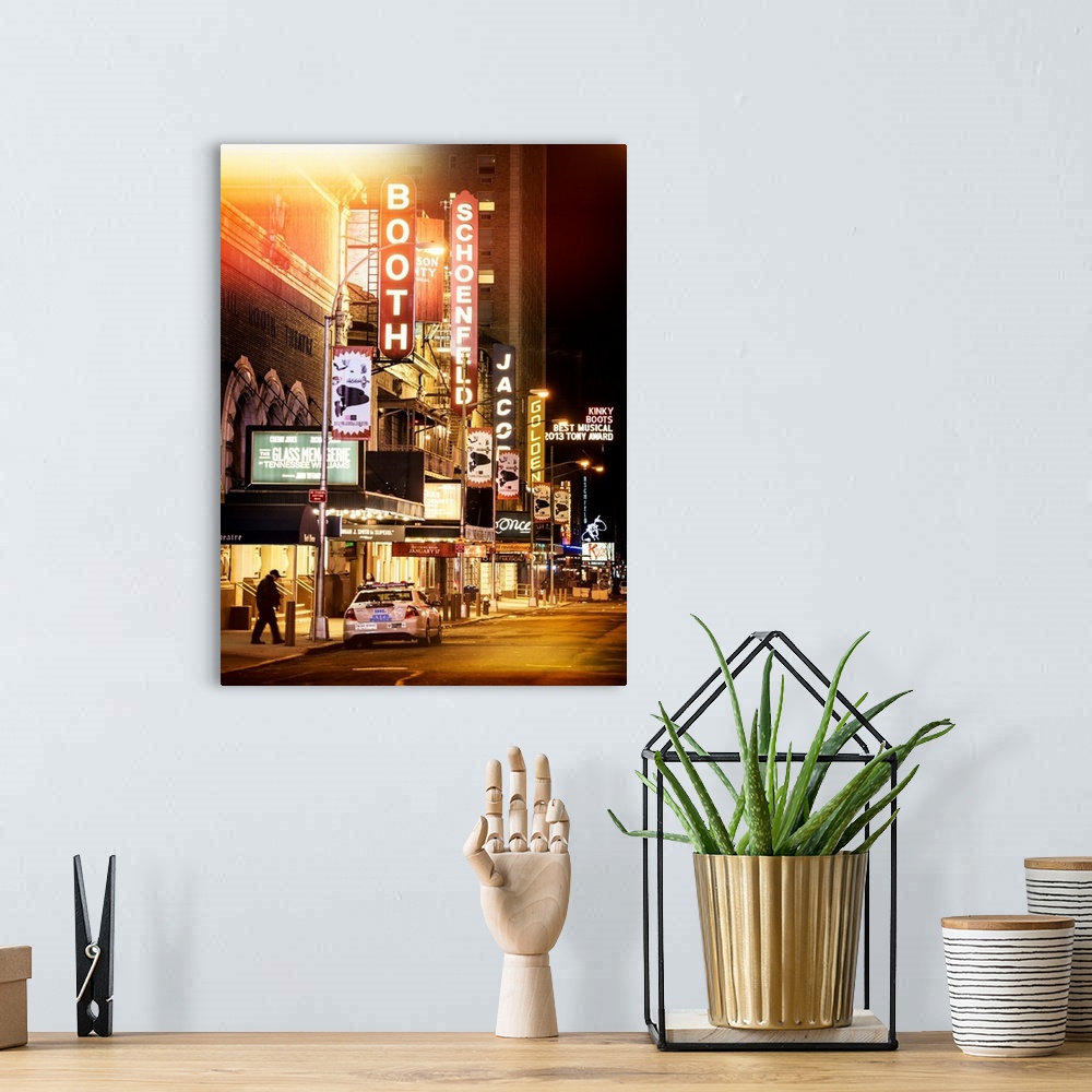 A bohemian room featuring A photograph of Broadway at night, New York city.