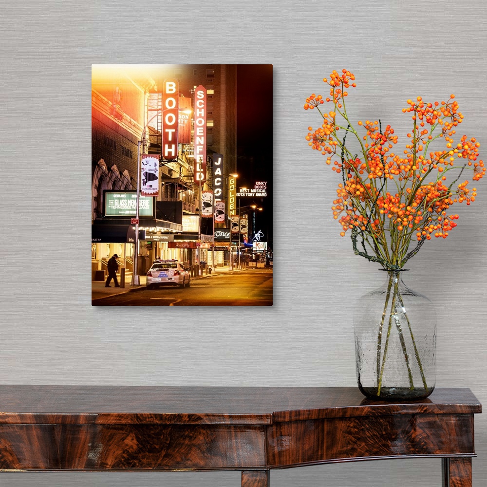 A traditional room featuring A photograph of Broadway at night, New York city.