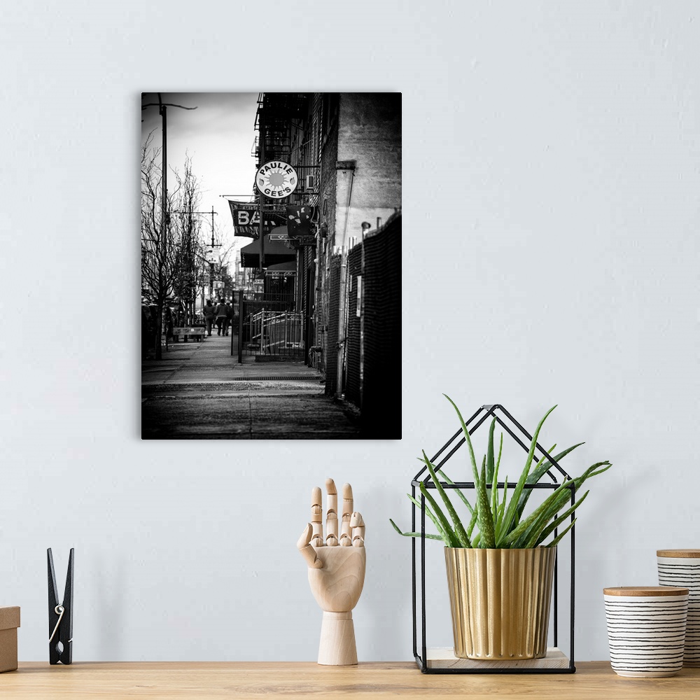 A bohemian room featuring A black and white photograph a sidewalk in Brooklyn.