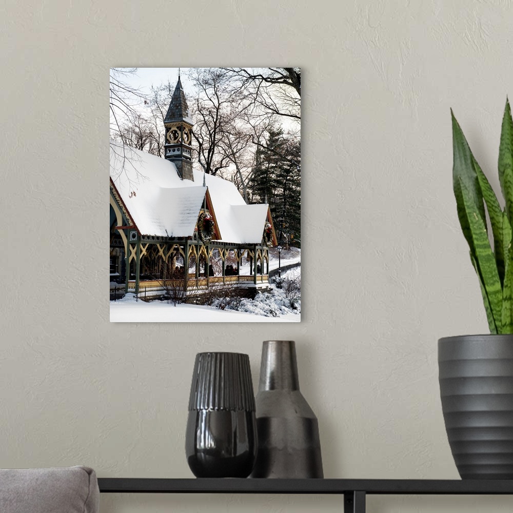 A modern room featuring A photograph looking at surrounding buildings around Central Park in winter, in NYC.