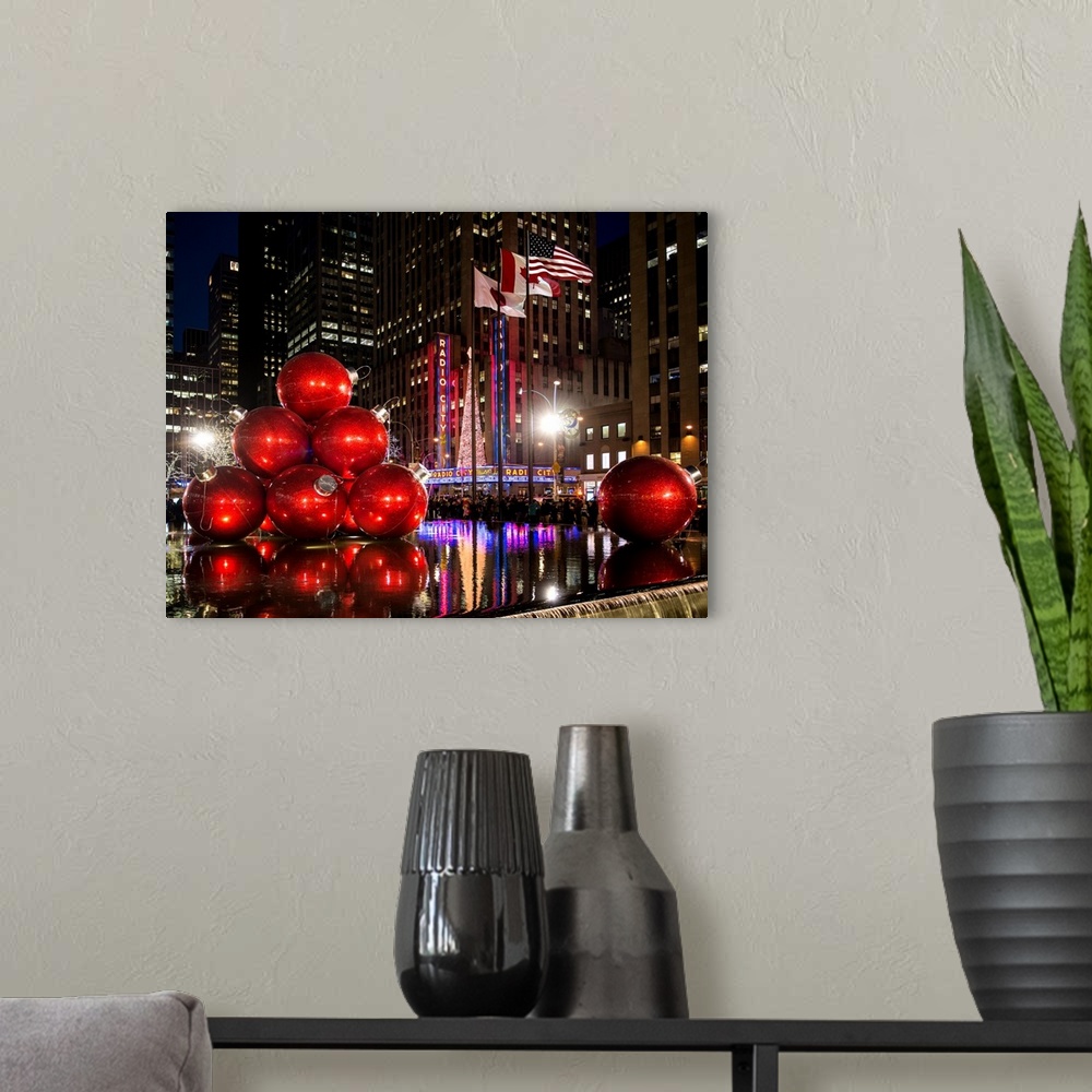 A modern room featuring Fine art photograph of giant Christmas decorations set up in New York city.