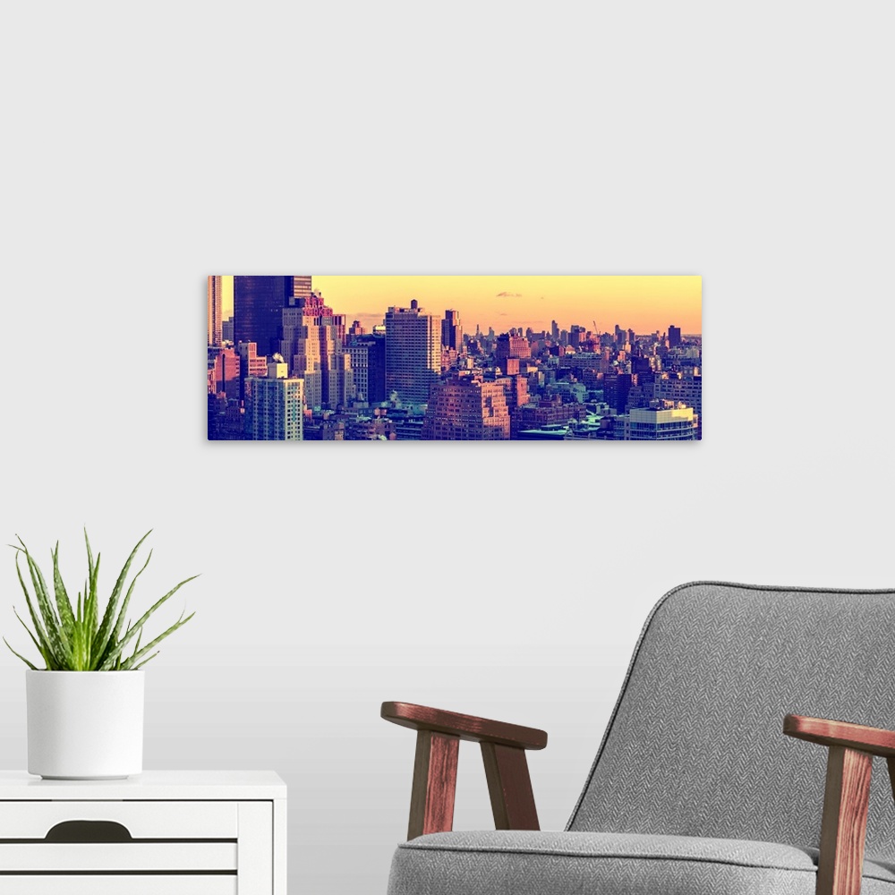A modern room featuring A photograph of New York city architecture at sunset.