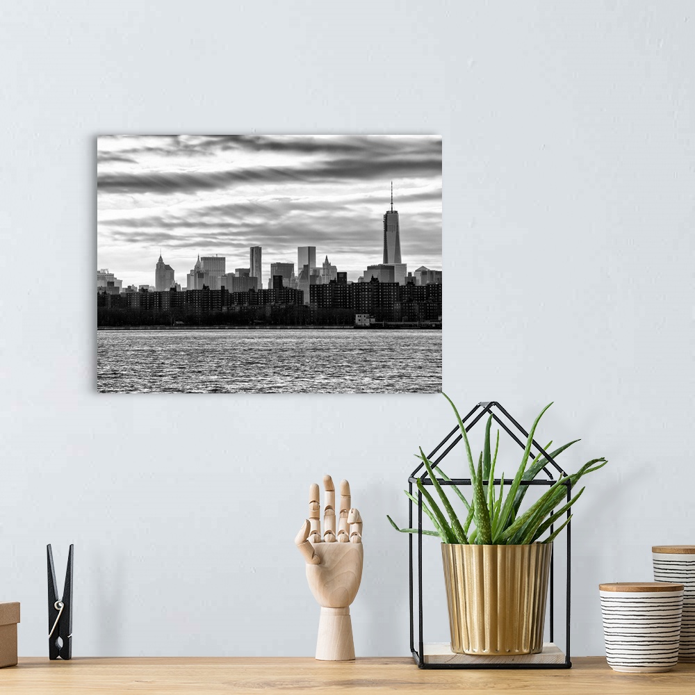 A bohemian room featuring A black and white photograph of the New York city skyline.