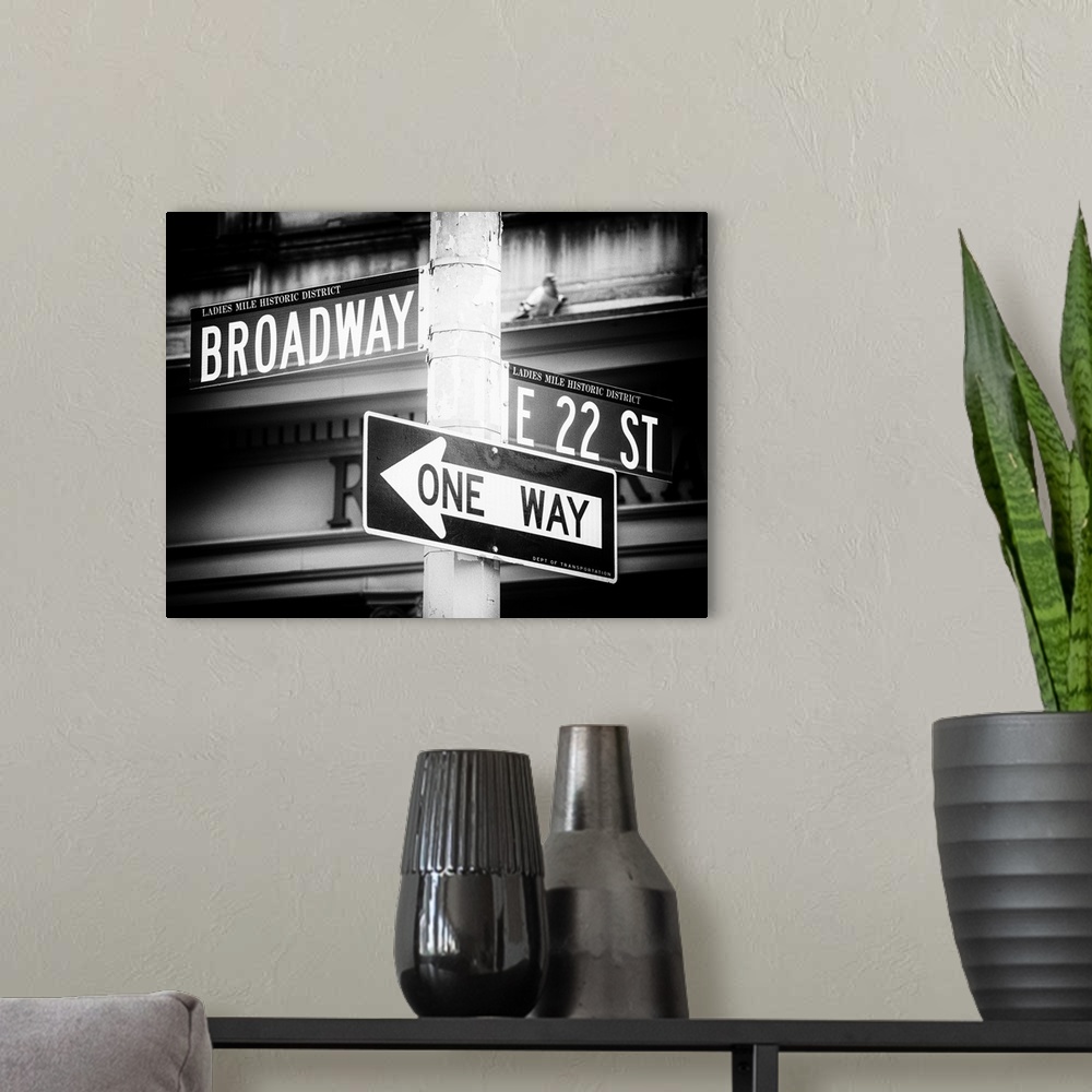 A modern room featuring A photograph of New York city street signs.