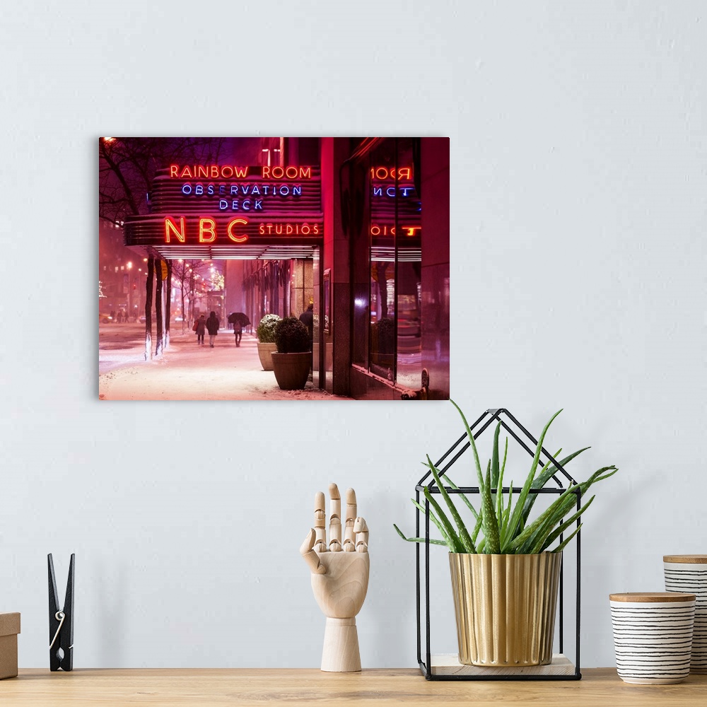 A bohemian room featuring A photograph of New York city at night, with neon light shining bright through the falling snow.