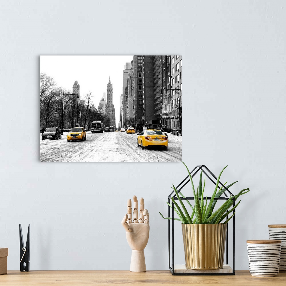 A bohemian room featuring A photograph looking down a road in New York city in winter.