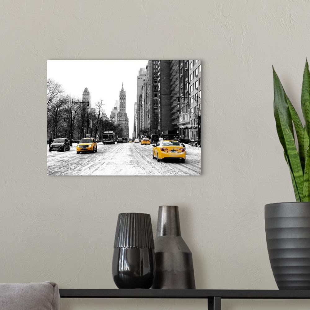 A modern room featuring A photograph looking down a road in New York city in winter.