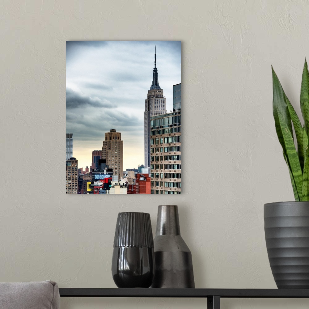A modern room featuring A photograph of the Empire state building standing tall in New York city.