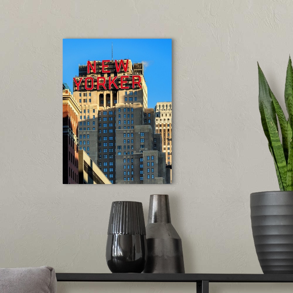 A modern room featuring A photograph of the New Yorker building in New York city.