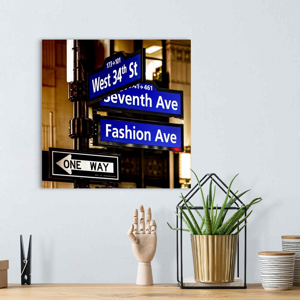 A bohemian room featuring A photograph of New York city street signs.