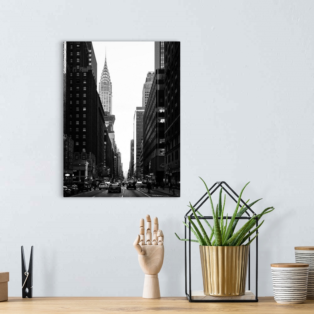 A bohemian room featuring A fine art photograph looking down a road in New York city with the Chrysler building sticking up...