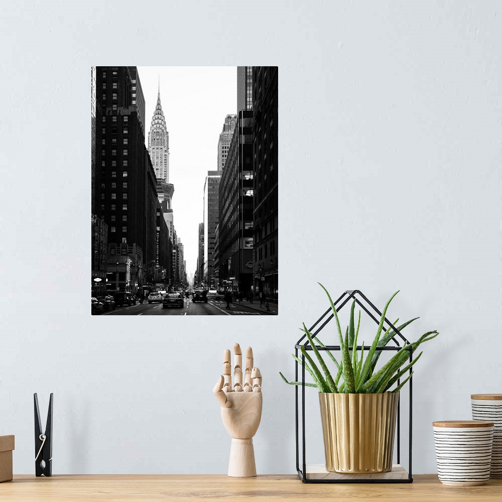 A bohemian room featuring A fine art photograph looking down a road in New York city with the Chrysler building sticking up...