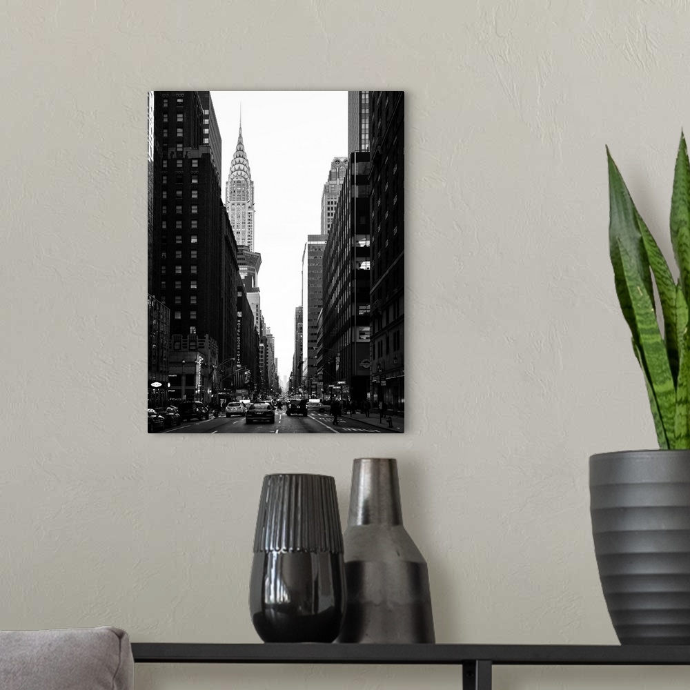 A modern room featuring A fine art photograph looking down a road in New York city with the Chrysler building sticking up...