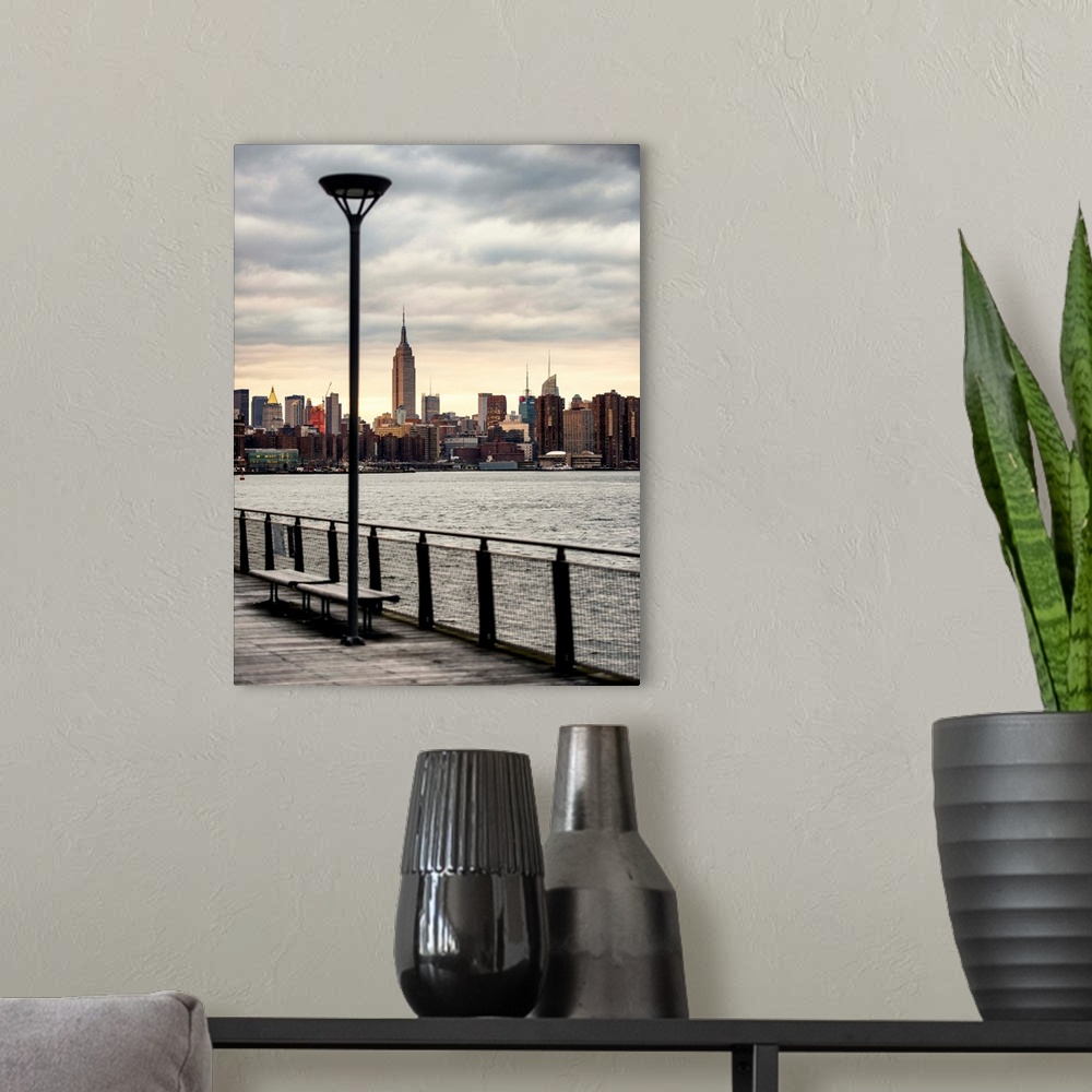 A modern room featuring A photograph of the Empire state building standing tall in NYC.