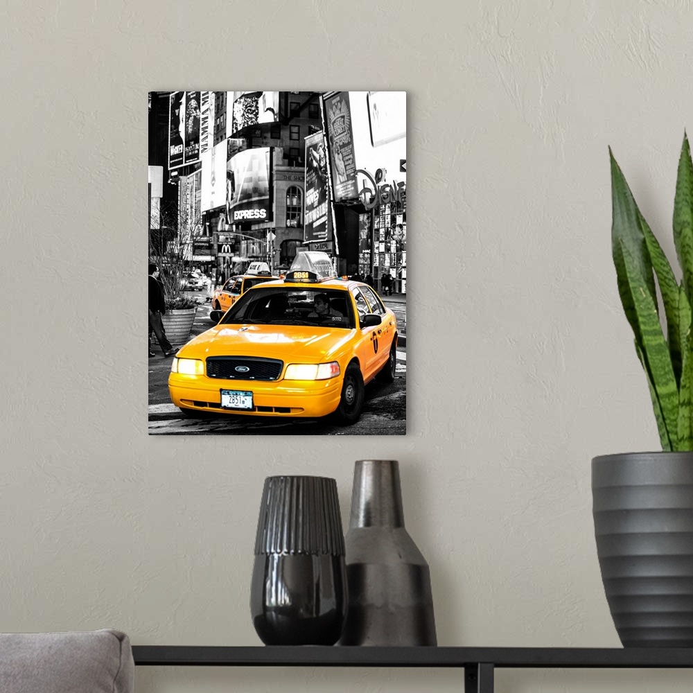 A modern room featuring A black and white photograph of New York city with a bright yellow taxi in focus.