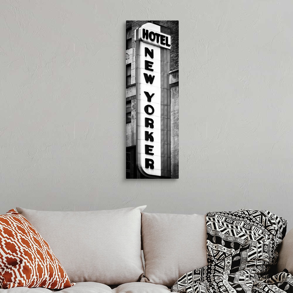 A bohemian room featuring Black and white photo of the vertical sign for the New Yorker hotel.