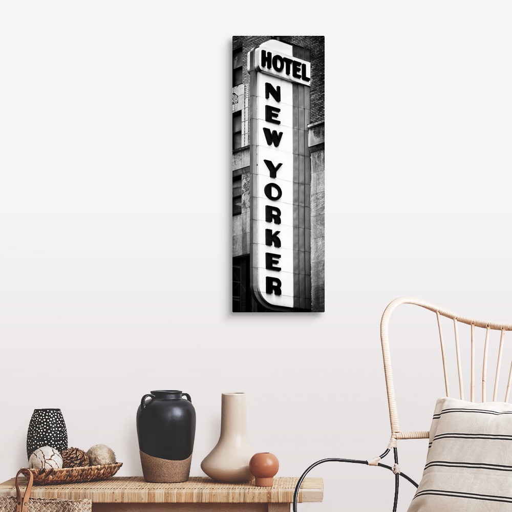 A farmhouse room featuring Black and white photo of the vertical sign for the New Yorker hotel.