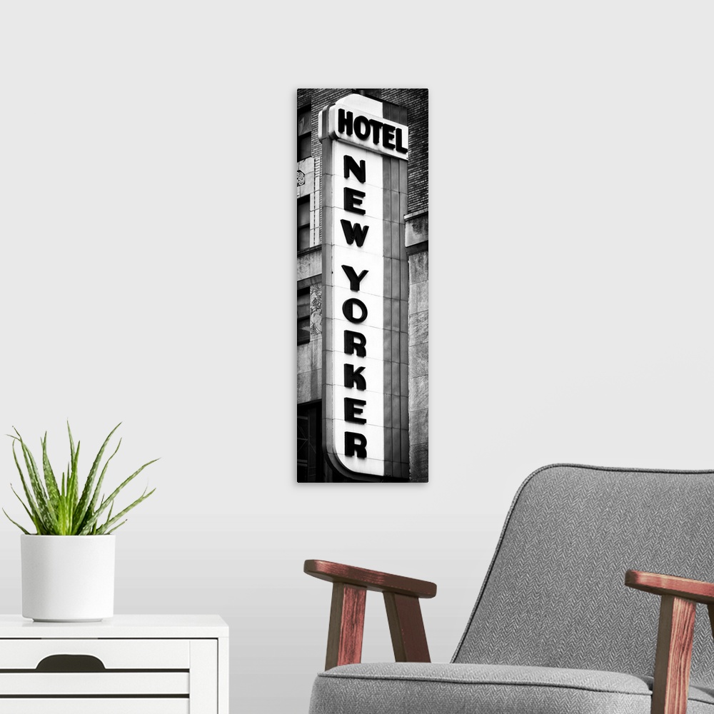 A modern room featuring Black and white photo of the vertical sign for the New Yorker hotel.