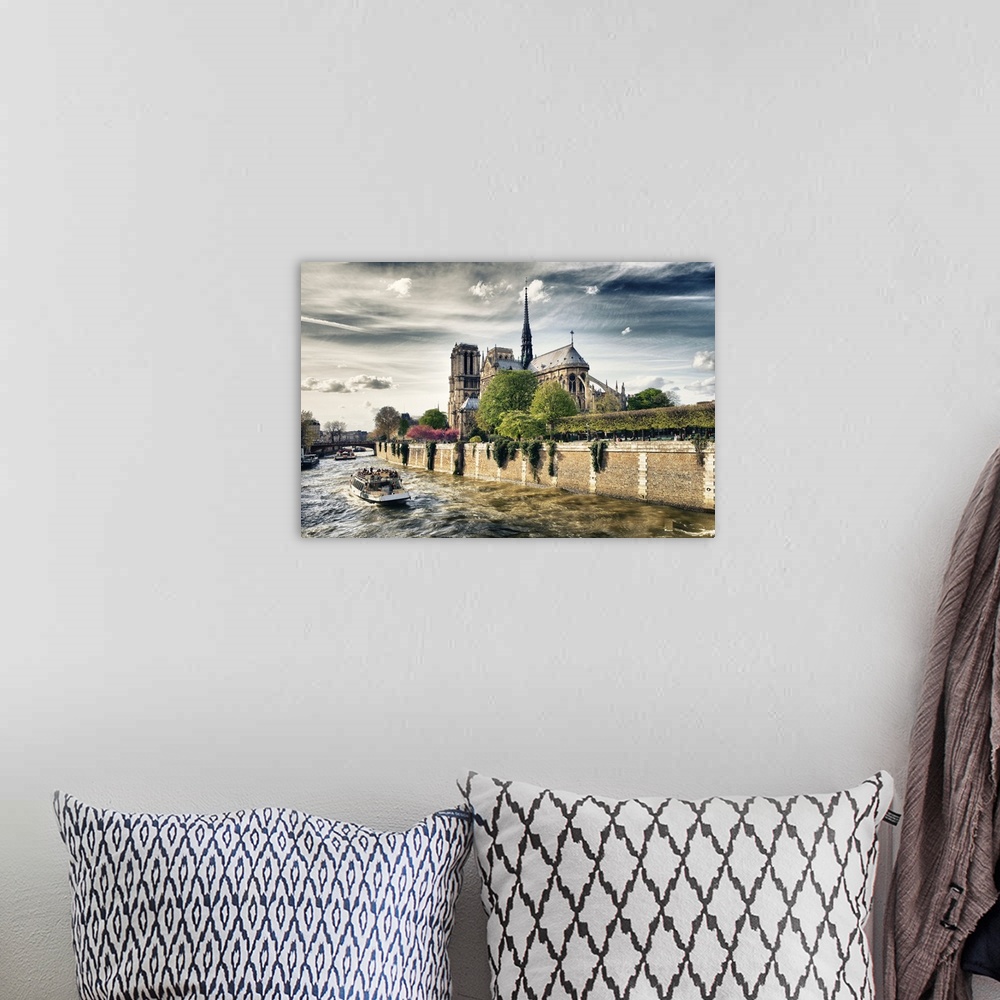 A bohemian room featuring Fine art photo of the Notre Dame Cathedral from the River Seine.