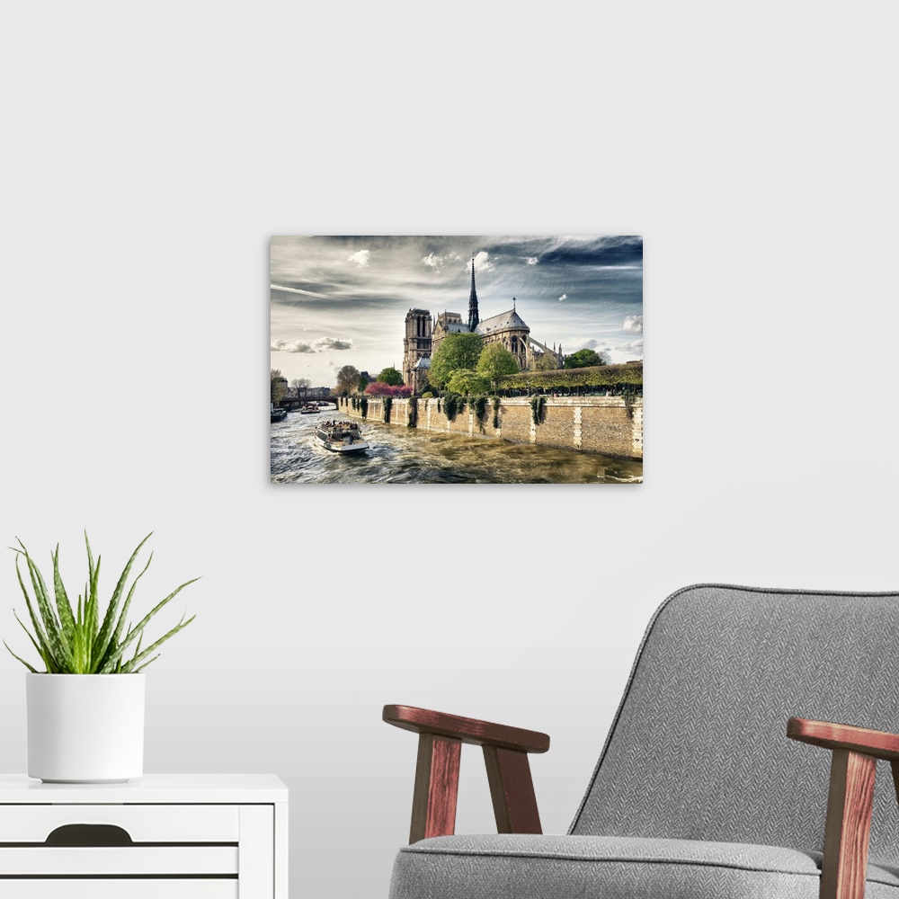A modern room featuring Fine art photo of the Notre Dame Cathedral from the River Seine.