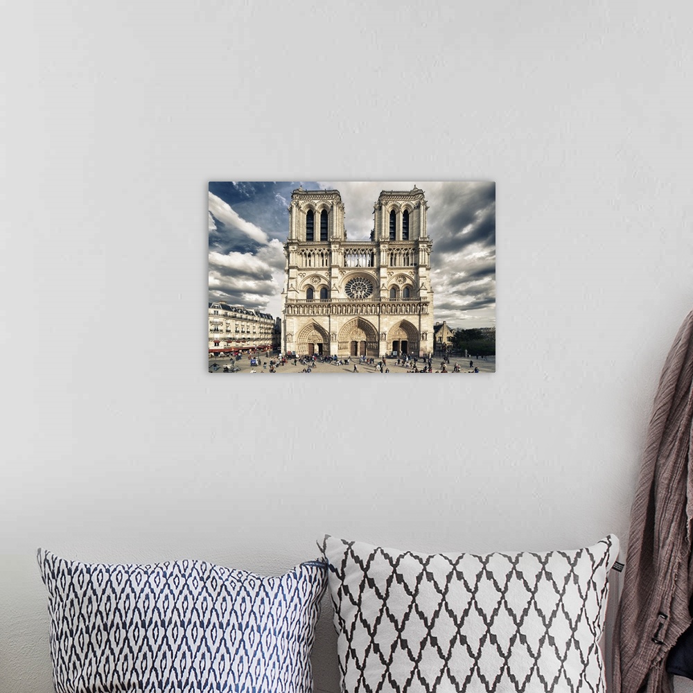 A bohemian room featuring Fine art photograph of the front of the Notre Dame of Paris Cathedral with a vivid sky.