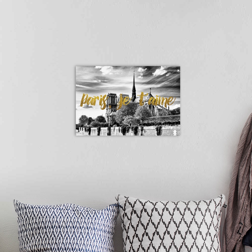 A bohemian room featuring Black and white photograph of Notre Dame Cathedral with the phrase "Paris, je t'aime" written in ...