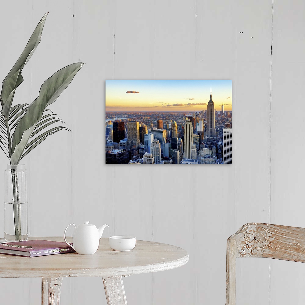 A farmhouse room featuring Fine art photo of the New York City skyline at sunset, with the Empire State Building on the right.