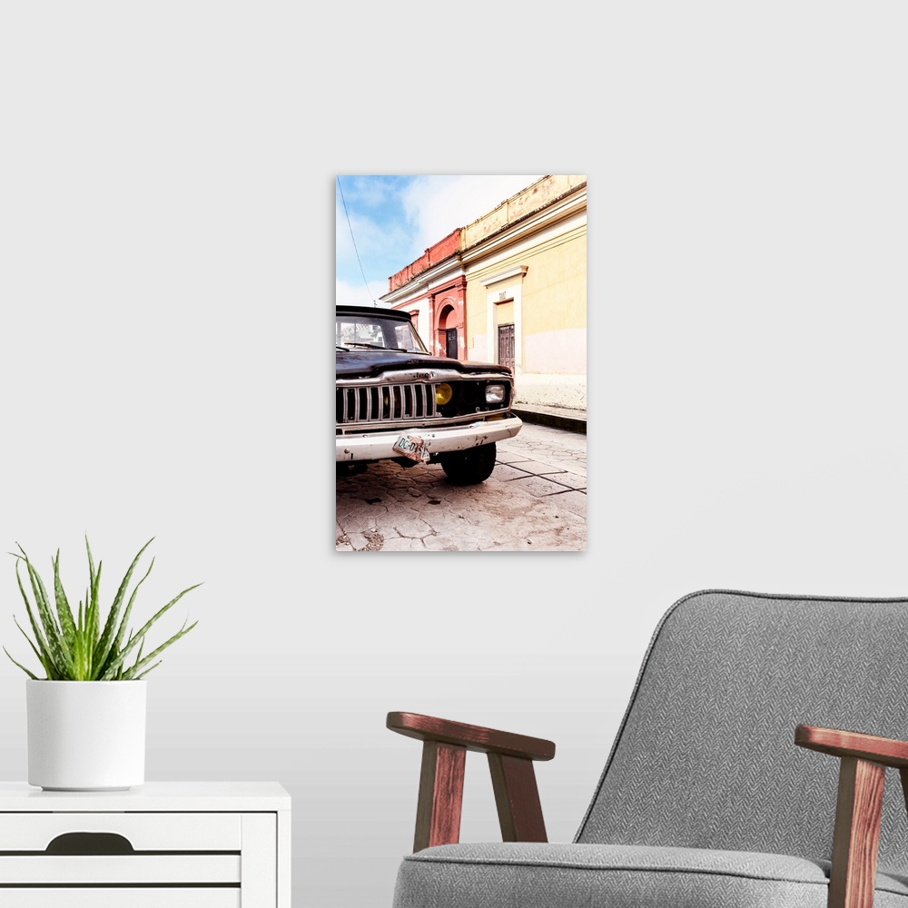 A modern room featuring Photograph of a colorful Mexican street with an old black Jeep on the road. From the Viva Mexico ...