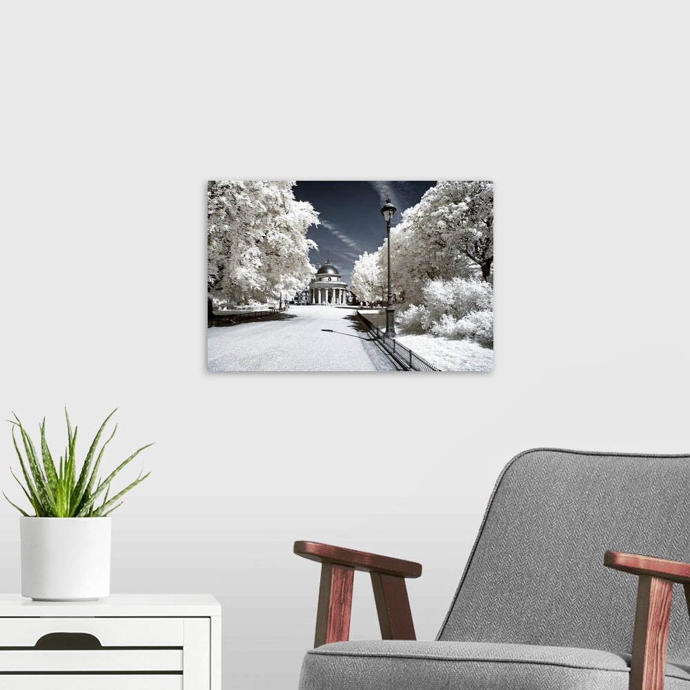 A modern room featuring A view of Parc Monceau in Paris, made in infrared mode in summer. The vegetation is white and ren...