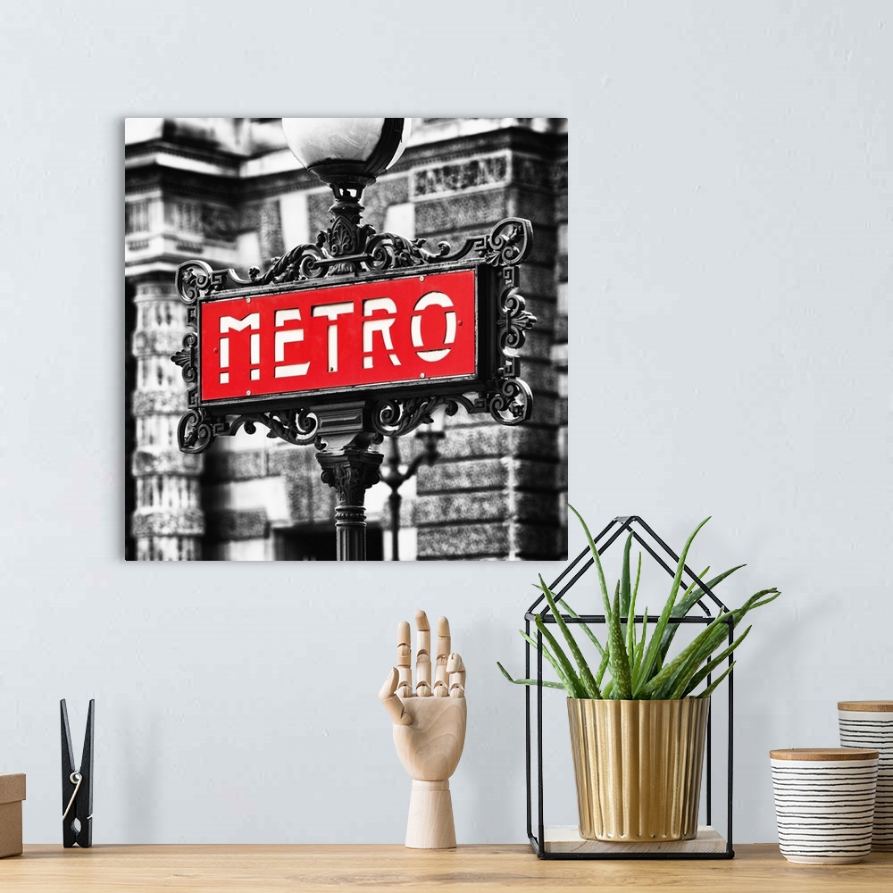 A bohemian room featuring Sign for an entrance to a Paris Metro station, or subway.