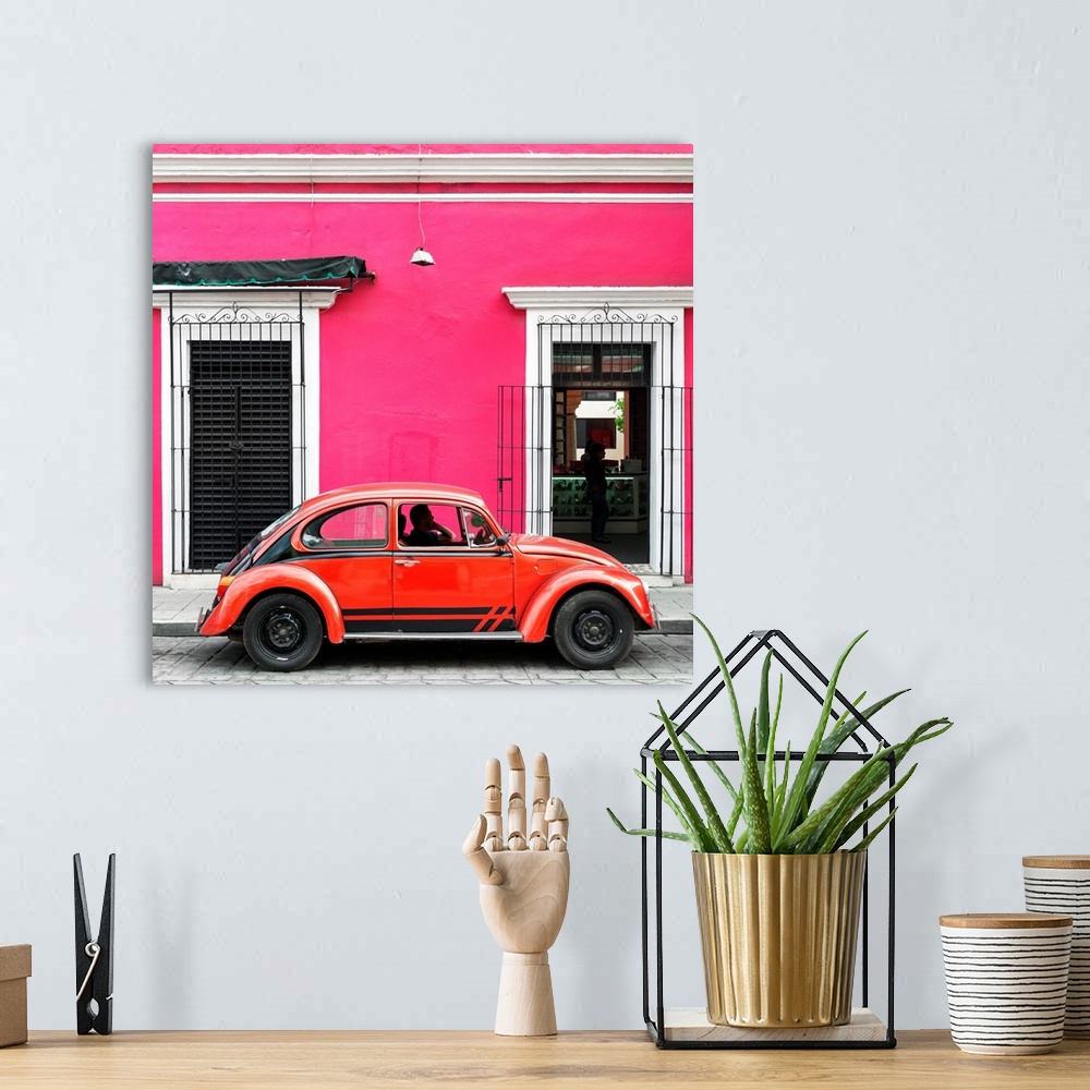 A bohemian room featuring Square photograph of a classic red Volkswagen Beetle parked in front of a pink building. From the...